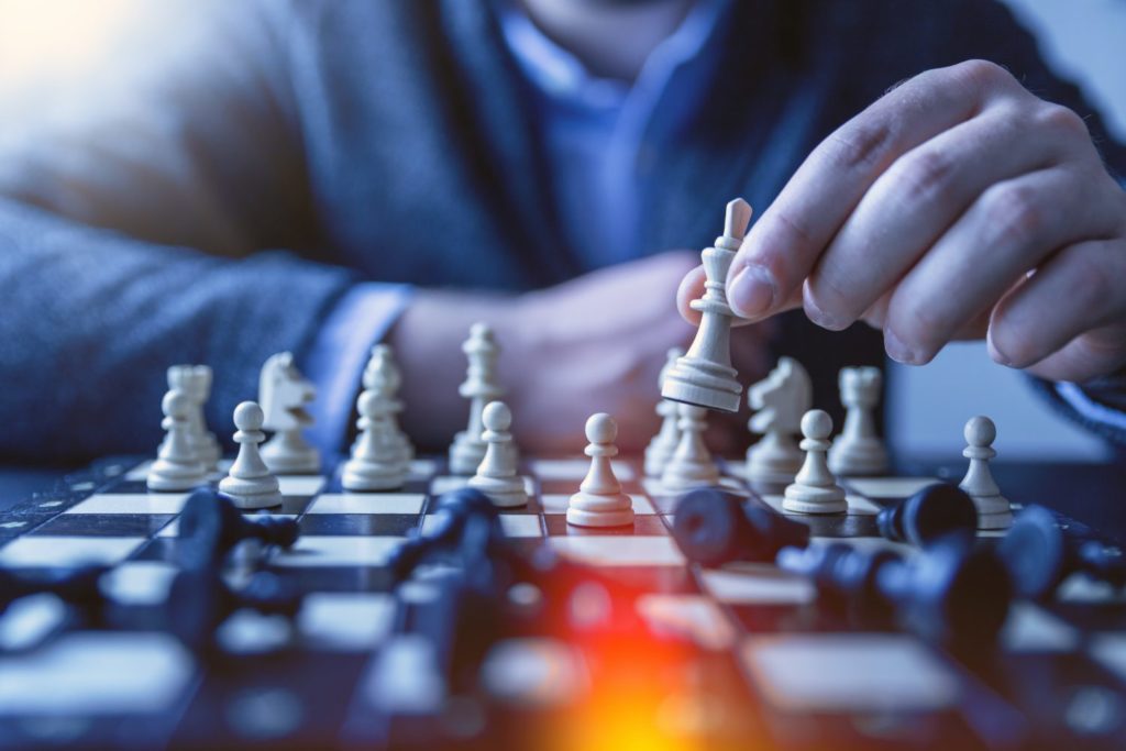 person playing chess is similar to seller's agent strategies.